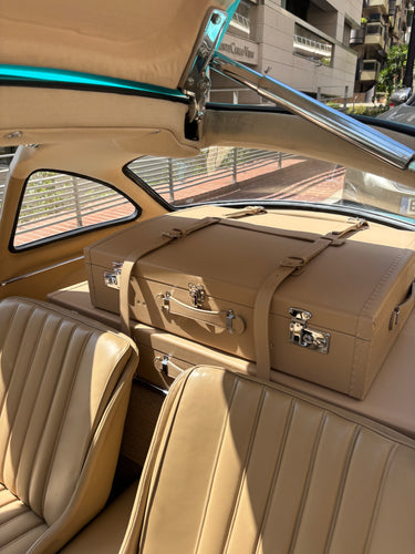 Bespoke tan leather luggage set fitted behind the seats of a Mercedes-Benz 300 SL Gullwing, handcrafted in France by Laurent Nay Maroquinerie.