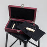 Handcrafted leather knife case with black microfiber interior and individual compartments by Laurent Nay Maroquinerie