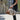 Marc canvas and leather travel bag carried in central Vichy