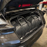 Bespoke leather luggage set perfectly fitted inside the trunk of an Aston Martin DB12 Volante
