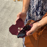Open leather sunglasses case showing its protective design
