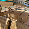 Bespoke tan leather luggage set fitted behind the seats of a Mercedes-Benz 300 SL Gullwing, handcrafted in France by Laurent Nay Maroquinerie.