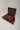 Open red leather suitcase with tartan lining stacked on matching fitted luggage for a Mercedes-Benz 300 SL Gullwing.